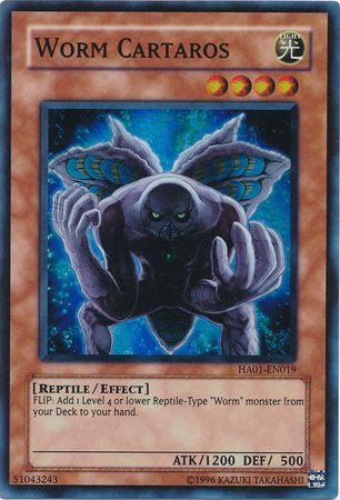 The Worm Cartaros [HA01-EN019] Super Rare trading card from the Yu-Gi-Oh! Hidden Arsenal set showcases a dark, humanoid creature with wings and three orange stars, indicating its level. The light attribute is displayed at the top right of the card. Beneath the image, you'll find the card's effect and stats (ATK: 1200, DEF: 500), along with its set information. The border features a distinctive orange and tan design.