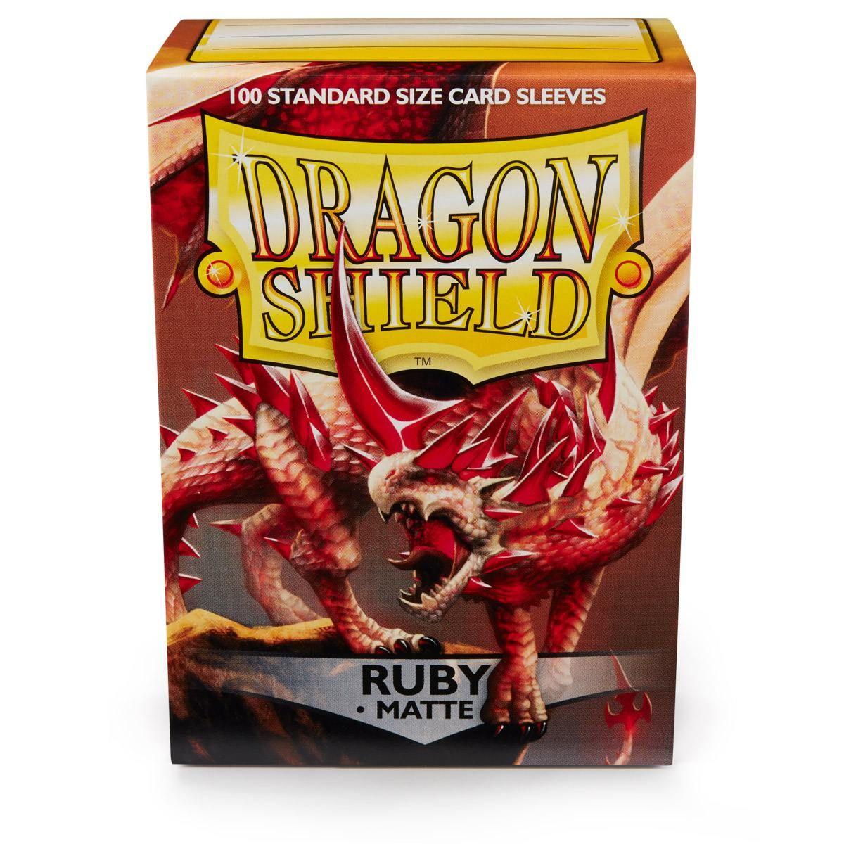 Arcane Tinmen's Dragon Shield: Standard 100ct Sleeves - Ruby (Matte) features a fierce red dragon with prominent horns and scales. It's perfect for protecting and showcasing your cards in style.