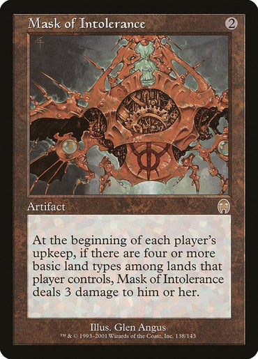 A rare Magic: The Gathering card, "Mask of Intolerance [Apocalypse]," is an artifact with a color palette dominated by browns and reds. The artwork features an intricate, spiky mask with gears and mechanical elements. Illustrated by Glen Angus and numbered 138/143, its text reads: "At each player’s upkeep, if there are four or more basic land types among lands that player controls . . .