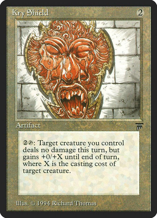 A "Magic: The Gathering" card titled "Kry Shield [Legends]," with a casting cost of 2 generic mana. It’s an uncommon artifact featuring a grotesque, red screaming face on a shield. For 2 mana, it lets a chosen creature prevent damage but gain toughness equal to its casting cost for the turn. Art by Richard Thomas. Released in 1994.