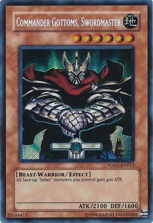 A Yu-Gi-Oh! trading card from the Hidden Arsenal series featuring "Commander Gottoms, Swordmaster [HA01-EN013] Secret Rare." This Secret Rare card shows a knight in shining armor wielding a rune-glowing sword. Its effect boosts the attack power of "Saber" monsters by 400. It has 2100 ATK and 1600 DEF points.