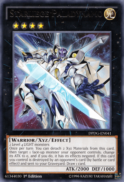 The image shows a Yu-Gi-Oh! Starliege Paladynamo [ZTIN-EN014] Ultra Rare card from the 2013 Zexal Collection Tin. This Level 4 LIGHT Xyz/Effect Monster has ATK 2000, DEF 1000, and appears as a futuristic armored warrior with a glowing sword, in silver and white with blue highlights.