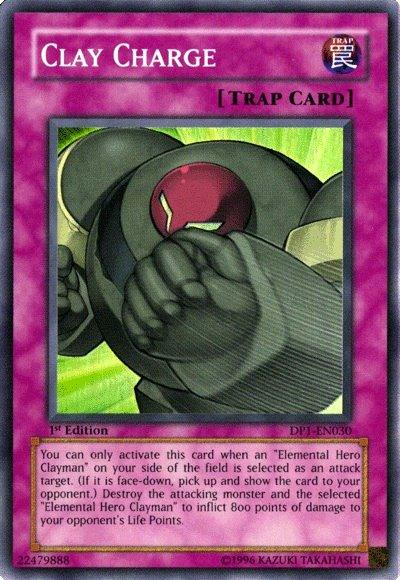 A Yu-Gi-Oh! trap card called "Clay Charge [DP1-EN030] Super Rare." This Super Rare card features an illustration of Elemental Hero Clayman in green armor with a red eye, throwing a powerful punch. The background is light green, and the card has purple borders. Below the image is a description detailing its effects and usage.