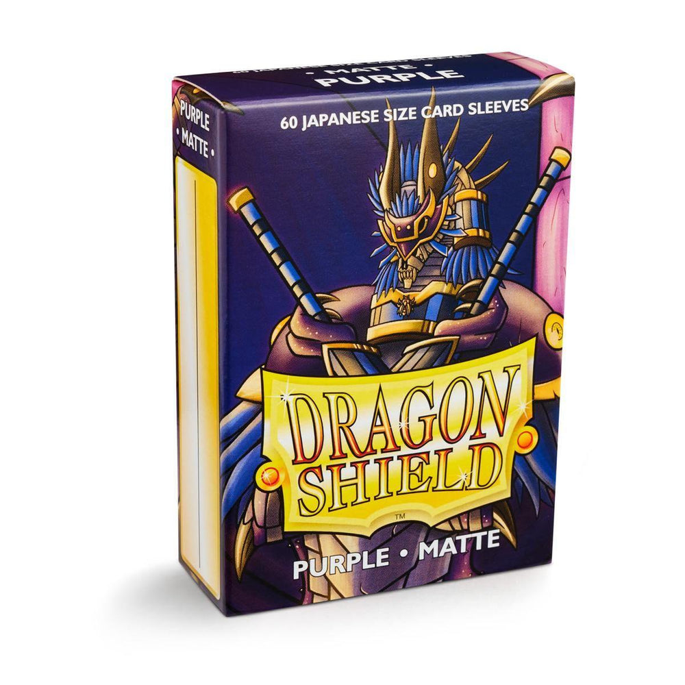 A box of Dragon Shield: Japanese Size 60ct Sleeves - Purple (Matte) by Arcane Tinmen. The packaging showcases an armored dragon figure wielding two swords and features the text "60 Japanese Size Card Sleeves" at the top. The "Dragon Shield" logo is prominently displayed on the front, ensuring quality and protection for your cards.