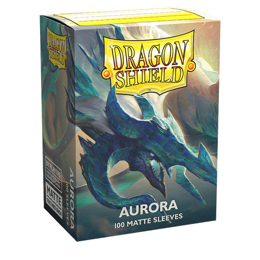 Box of Dragon Shield: Standard 100ct Sleeves - Aurora (Matte) featuring an illustration of a dragon in aurora-colored hues. The box, titled "Aurora," contains 100 matte TCG card sleeves. The dragon is predominantly blue with green and purple accents, set against a light background.