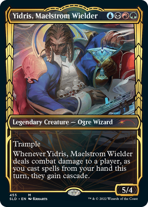 A Magic: The Gathering card titled "Yidris, Maelstrom Wielder (Showcase Gilded Foil) [Secret Lair Drop Series]." This Legendary Creature depicts an Ogre Wizard with horns, dressed in a regal blue and gold outfit, holding a martini glass. The text box states the card's Trample and cascade effects. The card's power and toughness are 5/4. Part of the Secret Lair Drop Series.