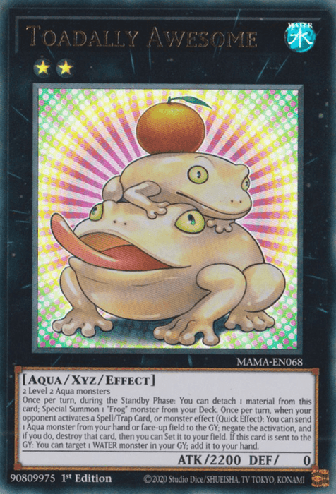 A Yu-Gi-Oh! trading card titled "Toadally Awesome [MAMA-EN068] Ultra Rare," an Xyz/Effect Monster with a blue background and water symbol. It features two cartoonish frogs—one larger with crossed eyes sitting on a lily pad holding a bubble, and a smaller excited frog on its head. Attack: 2200, Defense: 0.