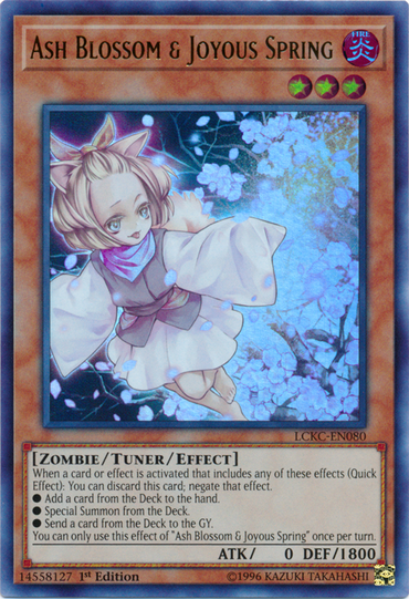 The Ultra Rare "Ash Blossom & Joyous Spring" card [LCKC-EN080] from Yu-Gi-Oh!'s Legendary Collection Kaiba features an anime-style character with white hair in a pink dress, surrounded by cherry blossoms. This Tuner/Effect Monster has ATK 0 and DEF 1800.