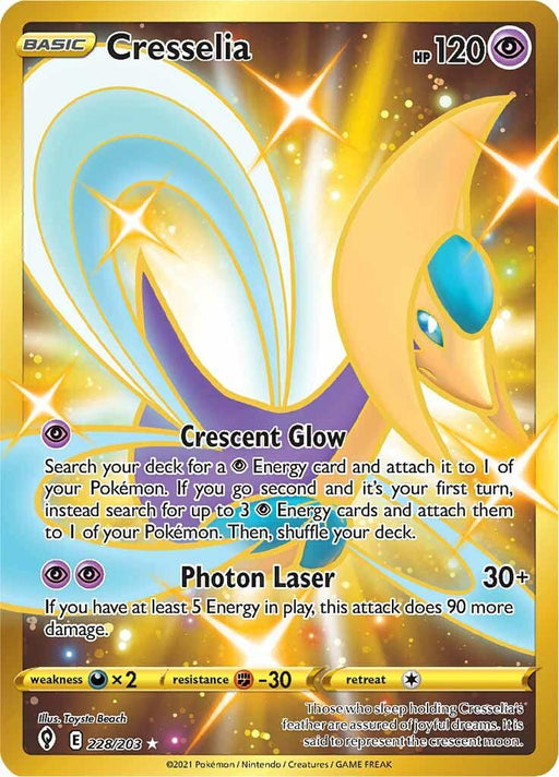 Cresselia (228/203) [Sword & Shield: Evolving Skies] from Pokémon. This Secret Rare features a majestic, golden-yellow Psychic creature with a crescent moon head and rainbow-like wings. It has 120 HP with attacks "Crescent Glow" and "Photon Laser," set against a sparkling gold background.