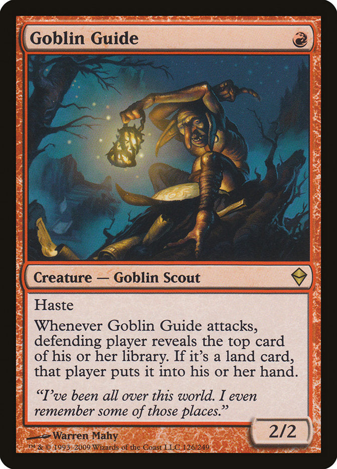 The Magic: The Gathering card "Goblin Guide [Zendikar]" illustrates a goblin with a lantern navigating a dark, rocky landscape on Zendikar. Characterized by its red border which indicates its connection to red mana, this rare creature card, identified as a "Goblin Scout," possesses the ability "Haste" and has stats of 2/2 power and toughness.