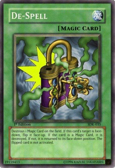 Image of a "De-Spell [SDK-035] Common" Magic Card from the game Yu-Gi-Oh! The card, part of the Starter Deck: Kaiba, depicts a broken padlock with green and gold details shattering, revealing a burst of yellow energy. The background is textured in blue. Descriptive text outlines this Normal Spell's function to destroy one Magic Card on the field.