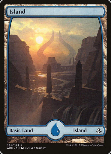 An Island (251) [Amonkhet] card titled "Island" features a serene, sunlit landscape with rocky formations and obelisks, reminiscent of Amonkhet. A massive, horn-shaped structure looms in the background. This Basic Land card is numbered 251/269, illustrated by Richard Wright, and has a water droplet symbol at the bottom.