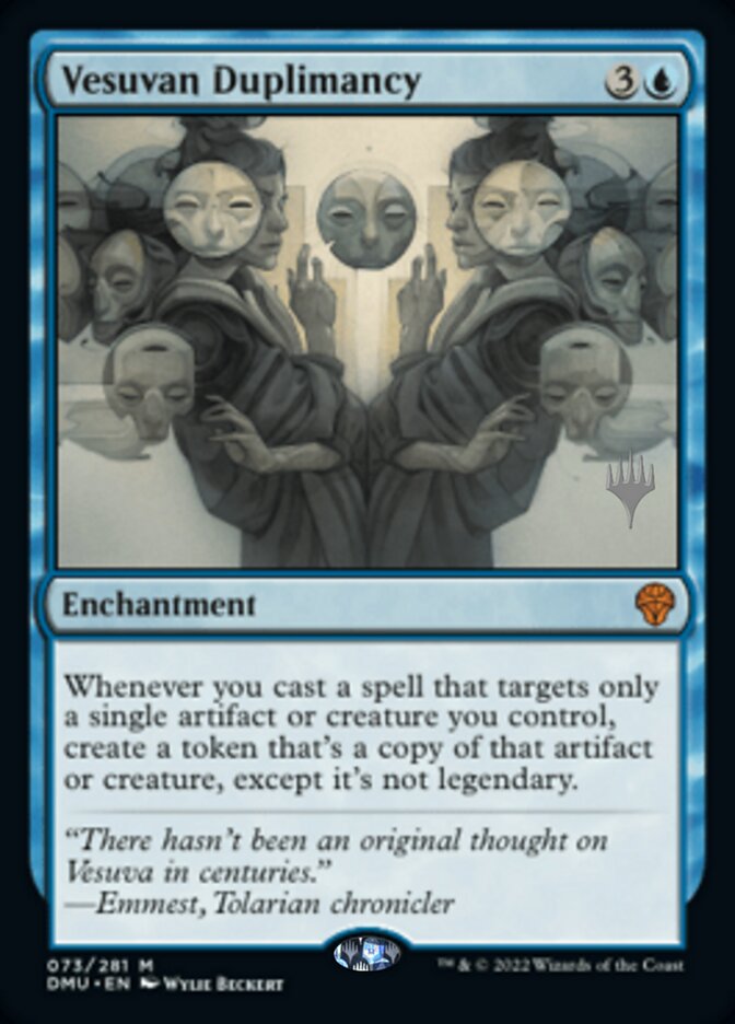 An image of the Magic: The Gathering card "Vesuvan Duplimancy (Promo Pack) [Dominaria United Promos]," part of the Dominaria United Promos series. The card has a blue border and features an illustration of robed, mask-wearing figures mirroring each other. This Mythic Enchantment costs 3 generic and 1 blue mana, with text describing its effect on a targeted artifact.