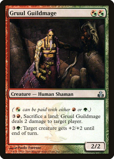 The Magic: The Gathering card "Gruul Guildmage [Guildpact]" displays a Human Shaman in tribal attire set against a rugged landscape. This red-green card has damage and creature enhancement abilities, with a power and toughness rating of 2/2.