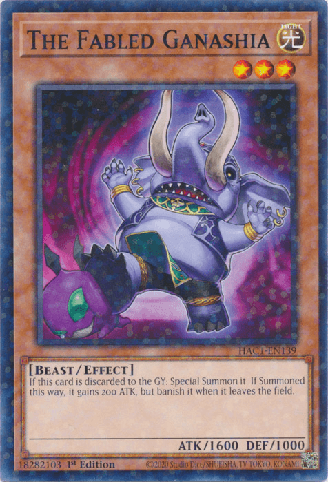 A Yu-Gi-Oh! trading card from the Hidden Arsenal series titled "The Fabled Ganashia (Duel Terminal) [HAC1-EN139] Common" depicts a cartoonish purple, elephant-like creature with two large tusks and golden rings on its trunk and ears. The Effect Monster is surrounded by a mystical aura and gains 200 ATK if Special Summoned from the GY.
