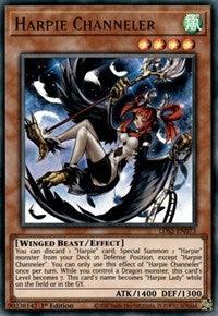 The Yu-Gi-Oh! trading card titled "Harpie Channeler [LDS2-EN073] Ultra Rare" features an illustrated humanoid winged character with green hair, wearing black and red attire while holding a staff. This Effect Monster boasts a Wind attribute, star level four, and stats of ATK 1400 and DEF 1300.