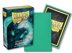 The image showcases a box of Arcane Tinmen's Dragon Shield: Japanese Size 60ct Sleeves - Aurora (Matte), featuring 60 matte sleeves. The front of the box displays a white dragon with an aqua theme. One sleeve is out of the box, highlighting its green matte side and the intricate dragon design on the back.