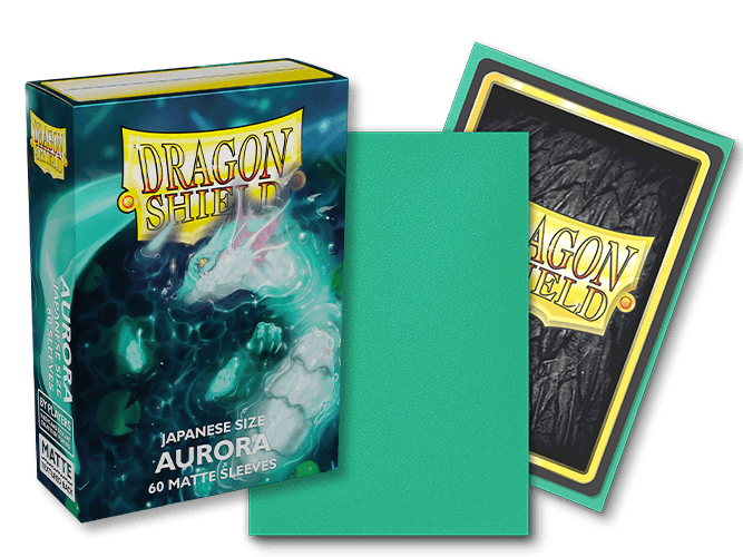 The image showcases a box of Arcane Tinmen's Dragon Shield: Japanese Size 60ct Sleeves - Aurora (Matte), featuring 60 matte sleeves. The front of the box displays a white dragon with an aqua theme. One sleeve is out of the box, highlighting its green matte side and the intricate dragon design on the back.