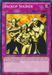 A Yu-Gi-Oh! collectible trading card titled "Backup Soldier [LDK2-ENY39] Common," depicting three muscular warriors standing confidently. This Normal Trap allows you to target up to 3 non-Effect Monsters with 1500 or less ATK in your Graveyard and add them to your hand, provided there are 5 or more monsters in your Graveyard.