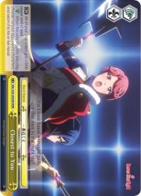 An anime-style trading card featuring two characters from Revue Starlight. The front character, with reddish-brown hair, wears a cape and holds a large, elaborate staff with a glowing tip. The second character, partially visible, has blue hair. This Climax Card includes game text, stats, and the title 