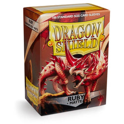 The Dragon Shield: Standard 100ct Sleeves - Ruby (Matte) by Arcane Tinmen features a red dragon with sharp claws and wings on a rocky backdrop. The box prominently displays the Dragon Shield logo, ensuring top-quality card protection.