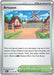 Image of a Pokémon trading card named "Artazon (171/193) [Scarlet & Violet: Paldea Evolved]" from the Stadium Trainer series. The card showcases a scenic village with windmills, red-roofed houses, and flower beds along a path. The game text explains that players can search their deck for a Basic Pokémon without a Rule Box and put it on their bench.