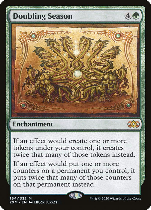 A beautifully designed Magic: The Gathering card named "Doubling Season [Double Masters]" showcases intricate gold and green scrollwork and two mirrored turtle-like creatures, exuding an enchanting aura. The text details effects of doubling tokens or counters, with artwork by Chuck Lukacs.