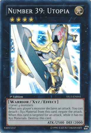 An image of the "Number 39: Utopia [YS13-EN041] Super Rare" Yu-Gi-Oh! trading card, a Super Rare Xyz/Effect Monster. The card features a futuristic warrior in white and gold armor with a blue shield and sword. It has a rank of 4 stars, an ATK of 2500, and DEF of 2000. The effect negates attacks by detaching