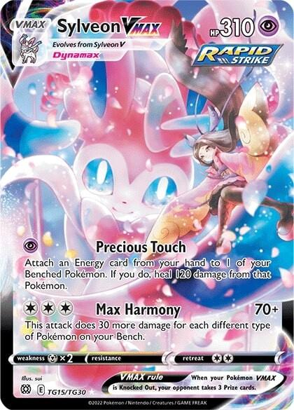 The image is a Secret Rare Pokémon trading card from the 2022 series, featuring Sylveon VMAX (TG15/TG30) [Sword & Shield: Brilliant Stars] by Pokémon. Sylveon, a pink and white fairy-type Pokémon, appears with its trainer. The card has 310 HP and includes the moves "Precious Touch" and "Max Harmony.