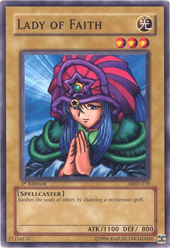 Image of the "Lady of Faith [MRD-119] Common" Yu-Gi-Oh! trading card from the Metal Raiders set. This common Normal Monster features a woman in a striped purple and red headdress, green clothing, and a serene expression with her hands in a praying gesture. The card has an ATK of 1100 and DEF of 800 and is categorized as a Spellcaster.