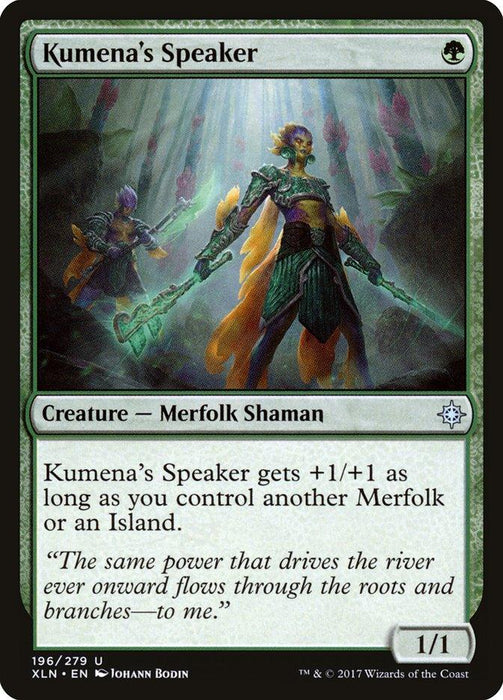 A Magic: The Gathering card titled "Kumena's Speaker [Ixalan]" features a striking illustration of a merfolk shaman wearing green armor and wielding a spear. The card text enhances the creature if the player controls another Merfolk or Island. Part of the Ixalan (XLN) set, it is illustrated by Johann Bodin.