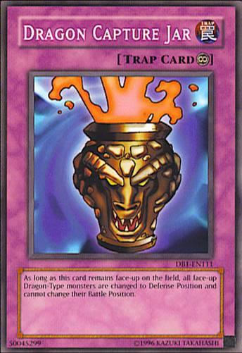 A "Yu-Gi-Oh!" trading card named Dragon Capture Jar [DB1-EN111] Common, belonging to the Continuous Trap category. The card features an image of a magical jar with a lid and dragon emblems, emitting flames and smoke. The bottom text describes its effect on Dragon-Type monsters' battle positioning and Defense Position.