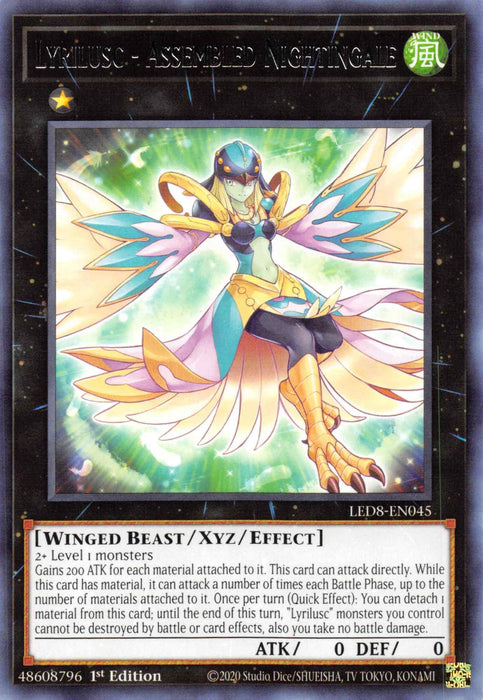 A Yu-Gi-Oh! trading card named "Lyrilusc - Assembled Nightingale [LED8-EN045] Rare" from the Legendary Duelists: Synchro Storm series. This Rare Xyz/Effect Monster showcases a blonde female figure in a blue and white outfit with gold accents, glowing wings, and is surrounded by light. The card details and stats are in the lower section.