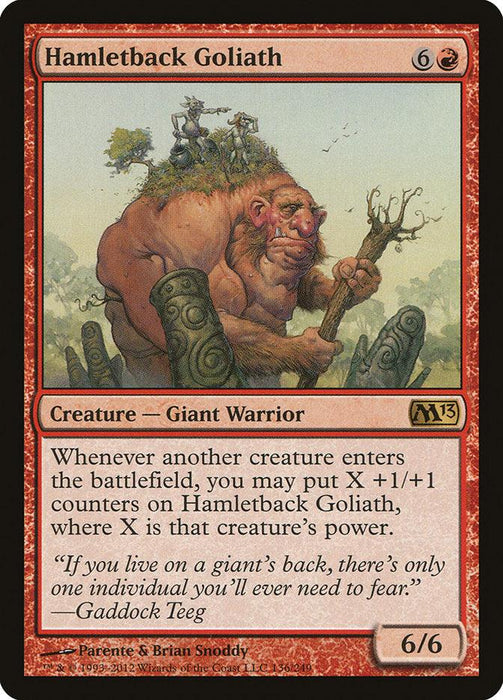 A card from Magic: The Gathering titled "Hamletback Goliath [Magic 2013]." This Giant Warrior costs 6 and 1 red mana, boasting 6 power and 6 toughness. Its ability adds +1/+1 counters when another creature enters the battlefield. The artwork features a giant with tiny figures on its back.
