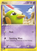 Description: A common Pokémon trading card for Natu (69/100) [EX: Sandstorm] with 50 HP from the EX Sandstorm series, classified as a Basic type. The card's artwork features Natu, a small, green bird-like Pokémon with a red head crest and yellow beak, standing in a rocky desert landscape under a blue sky. The moves listed are Peck with 10 damage and Soothing Wave.

