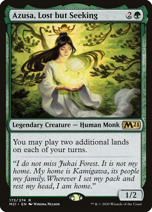 A magical card from Magic: The Gathering showcases "Azusa, Lost but Seeking [Core Set 2021]," a Legendary Creature - Human Monk. Illustrated with a serene expression and holding a glowing orb amidst lush greenery, the card text permits playing two additional lands each turn. It features a power/toughness of 1/2 and is marked as rare.