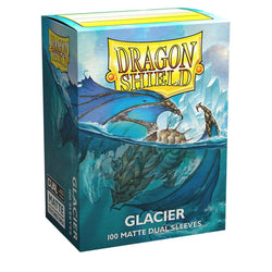 A box of Arcane Tinmen: Dragon Shield: Standard 100ct Sleeves - Glacier (Dual Matte) features an illustration of a fierce blue dragon swimming in icy waters with icebergs in the background. The sturdy cardboard box contains 100 matte dual sleeves with a black interior. The Dragon Shield logo is prominent at the top.