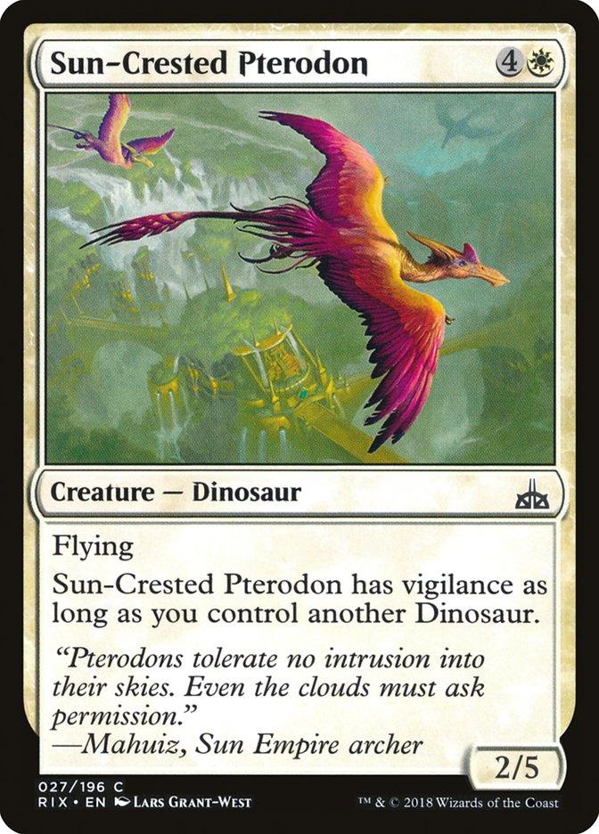 The Magic: The Gathering product titled Sun-Crested Pterodon [Rivals of Ixalan] depicts a flying, orange Dinosaur with pink-tipped wings soaring over a mountainous landscape. Below the image, it's noted that it has vigilance if you control another Dinosaur. Flavour text mentions 