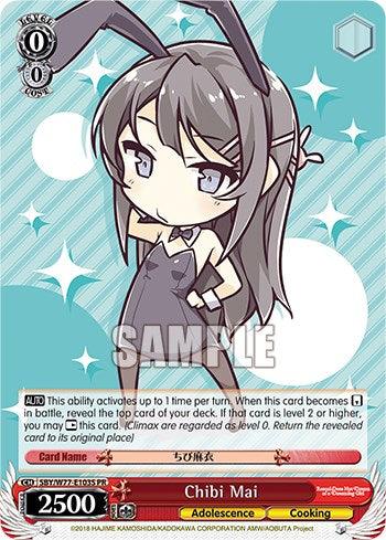 A promotional card from Bushiroad featuring a chibi-style character named Chibi Mai (Foil) [Promotional Cards] with long black hair, dressed in a bunny costume with ears and a tail. The character stands against a turquoise background with white bubbles. Below the image, various game stats, text, and icons are displayed in red and white boxes.