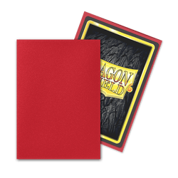 Two Dragon Shield: Japanese Size 60ct Sleeves - Ruby (Matte) by Arcane Tinmen on a gray background. The front sleeve is red and covers most of the image. The back sleeve is angled, showcasing its front, which has a black textured surface with a yellow border and the words "DRAGON SHIELD" in red and yellow.