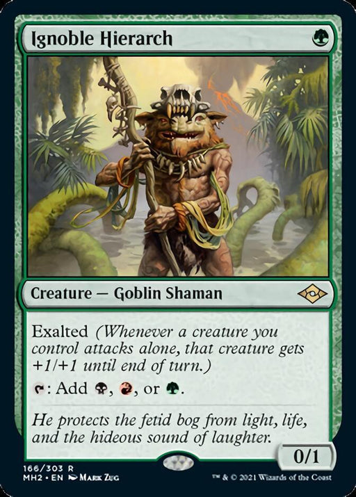 Card titled "Ignoble Hierarch [Modern Horizons 2]" from Magic: The Gathering. Art depicts a Goblin Shaman standing in a swamp, wielding a staff decorated with animal bones and vines. The shaman has a skull headdress, is surrounded by green vegetation, and features the Exalted ability along with game mechanics and flavor text.