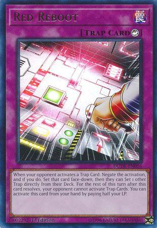 A Yu-Gi-Oh! card named "Red Reboot [DUDE-EN056] Ultra Rare," labeled as an Ultra Rare Trap Card. The image on the card shows a glowing, high-tech control panel with a robotic hand pressing a button that emanates bright pink light. The card text details its activation conditions and effects to negate Trap cards within the game.