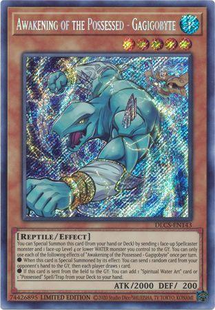 A Yu-Gi-Oh! trading card titled "Awakening of the Possessed - Gagigobyte [DLCS-EN143] Secret Rare," an Effect Monster from the Dragons of Legend series. The card features a blue reptilian creature with large arms, sharp claws, and a fierce expression on a holographic background. Its stats are ATK/2000 DEF/200, with a detailed description of its abilities.