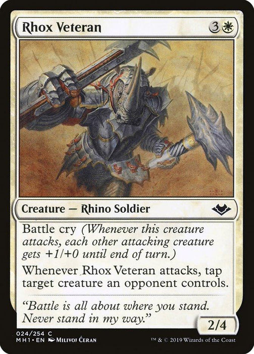 A Magic: The Gathering card titled "Rhox Veteran [Modern Horizons]" showcases a formidable Rhino Soldier, armored and wielding a large axe and shield. This 2/4 creature costs 3W mana and features Battle Cry, tapping target enemy creature when it attacks. Illustrated by Milivoj Čeran.