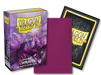 A box of Arcane Tinmen's Dragon Shield: Japanese Size 60ct Sleeves - Wraith (Dual Matte) is next to the front and back views of a single sleeve. The box features fantasy artwork of a ghostly figure. The TCG sleeve's front is purple, while the back has a black dragon scale pattern with the Dragon Shield logo.