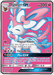 Ultra Rare Pokémon card from the Sun & Moon series featuring Sylveon GX (140/145) [Sun & Moon: Guardians Rising] by Pokémon with 200 HP. The Fairy-type card boasts abilities: Magical Ribbon to search for 3 cards, and Fairy Wind, dealing 110 damage. The GX move, Plea GX, moves 2 benched Pokémon into the opponent's hand. Weakness: Metal ×2. Resistance: Darkness -20. Retreat cost