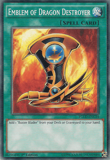 The image features a Yu-Gi-Oh! spell card named "Emblem of Dragon Destroyer [YGLD-ENC34] Common" from Yugi's Legendary Decks. It displays golden armor adorned with a blue emblem set against a blazing orange backdrop. The card description reads: "Add 1 'Buster Blader' from your Deck or Graveyard to your hand.