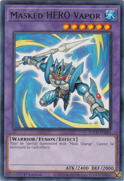 A Yu-Gi-Oh! trading card featuring "Masked Hero Vapor [TOCH-EN044] Rare." It shows a blue-armored warrior with a red visor and metallic wings, flying through an electrified vortex. The card text specifies summoning conditions using Mask Change and abilities. The card's stats are ATK 2400 and DEF 2000.
