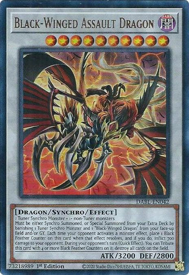 A Yu-Gi-Oh! card titled "Black-Winged Assault Dragon [DABL-EN042] Ultra Rare," an Ultra Rare Synchro/Effect Monster featuring a dark dragon with large metallic wings, claws, and a fiery background. The card details its type as Dragon/Synchro/Effect, hinting at special summoning conditions and attack abilities. It has 3200 ATK and 2800 DEF.