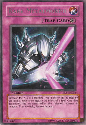 The image shows a Yu-Gi-Oh! card titled "Rare Metalmorph [RDS-EN052] Rare" from the Rise of Destiny set. This Continuous Trap Card features a metallic Machine-Type monster surrounded by a pink aura, with its hand extended as it emits a pink, glowing beam. The card number is RDS-EN052.